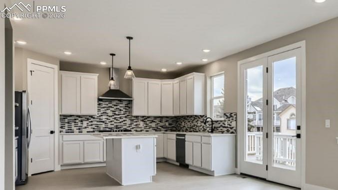 5499 Remuda Rnch Parkway Sedalia, CO 80135 - Photo 5 of 19 a kitchen with white cabinets and refrigerator