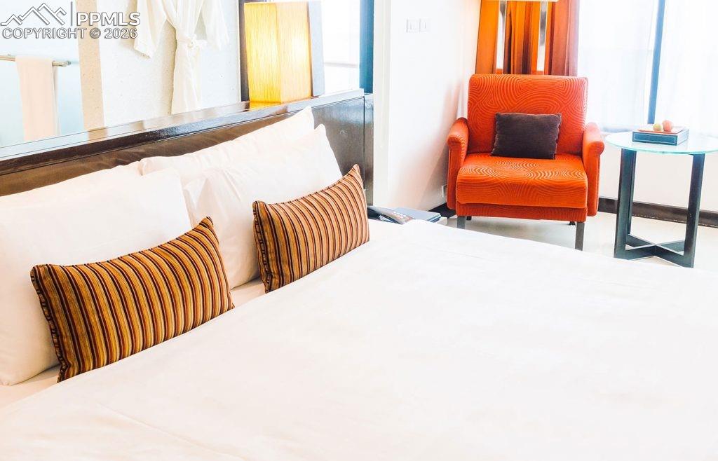 5499 Remuda Rnch Parkway Sedalia, CO 80135 - Photo 8 of 19 a bedroom with two beds and a couch