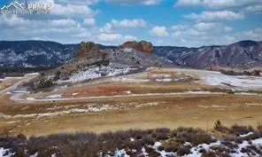 a view of a lake in middle of the green field