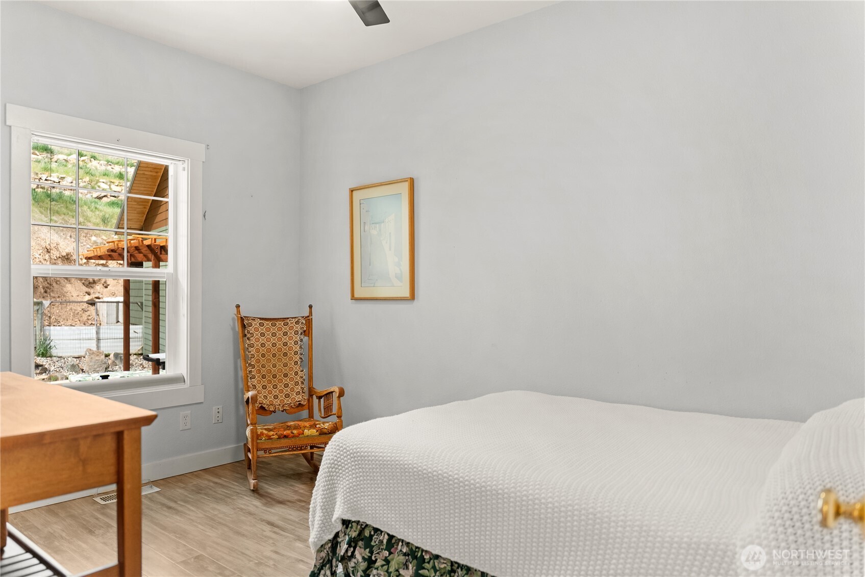 183 Twisp Carlton Road Carlton, WA 98814 - Photo 29 of 40 a bedroom with a bed and wooden floor