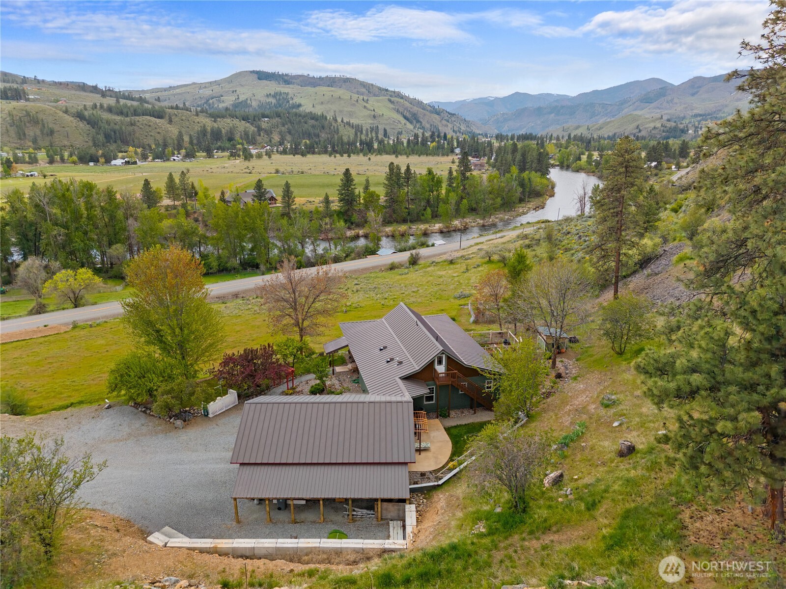 183 Twisp Carlton Road Carlton, WA 98814 - Photo 4 of 40 a view of a lake with a mountain in the background