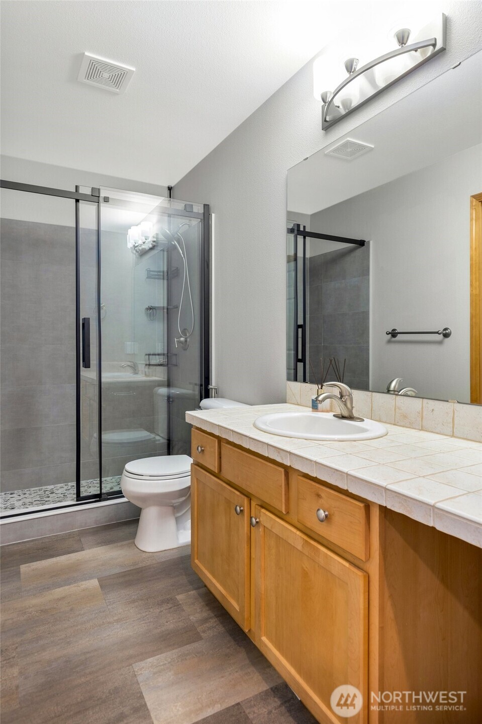 308 170th Place Southeast Bothell, WA 98012 - Photo 21 of 40 a bathroom with a sink toilet and shower