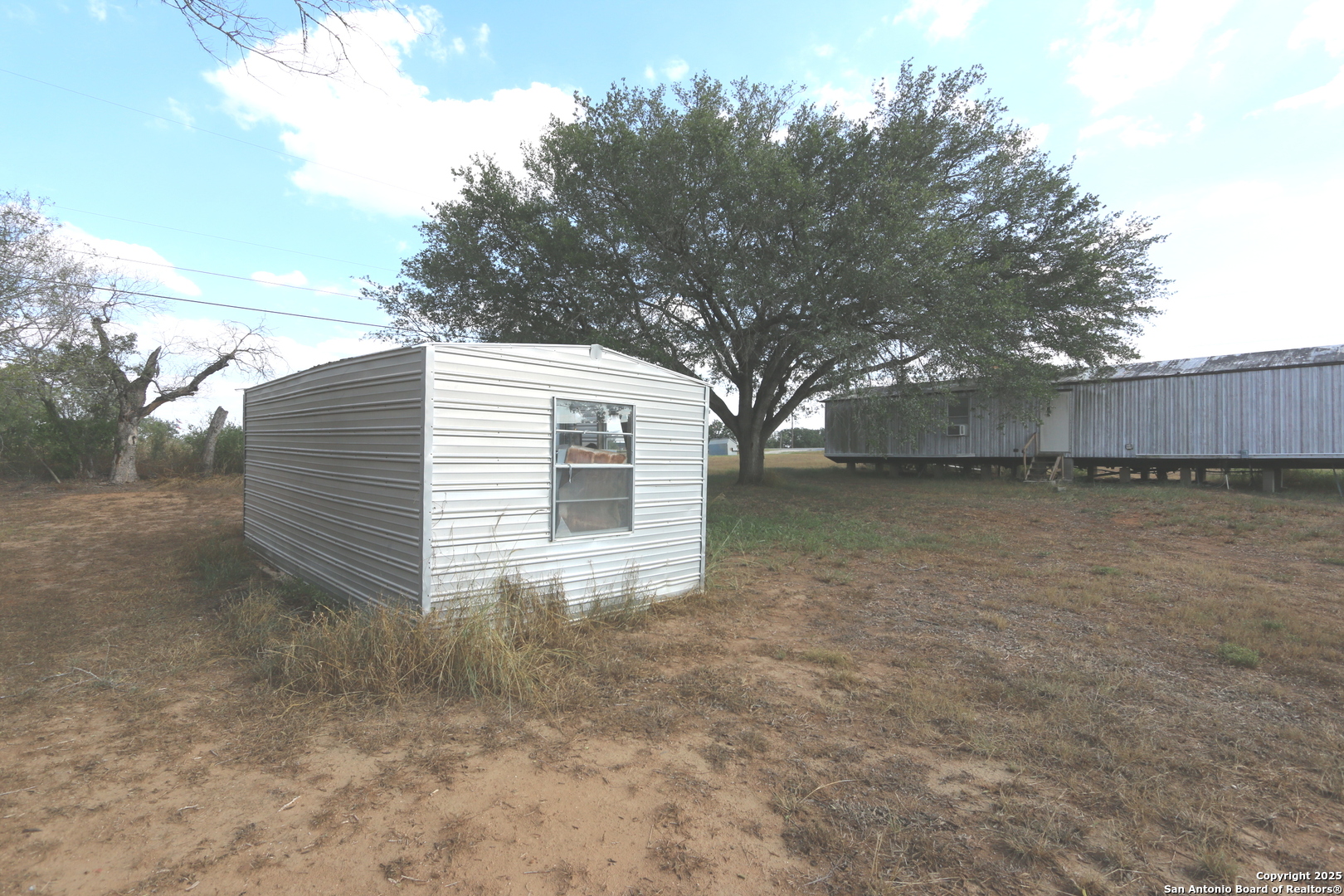 13847 Highway 87 Adkins, TX 78101 - Photo 12 of 23 a view of a backyard
