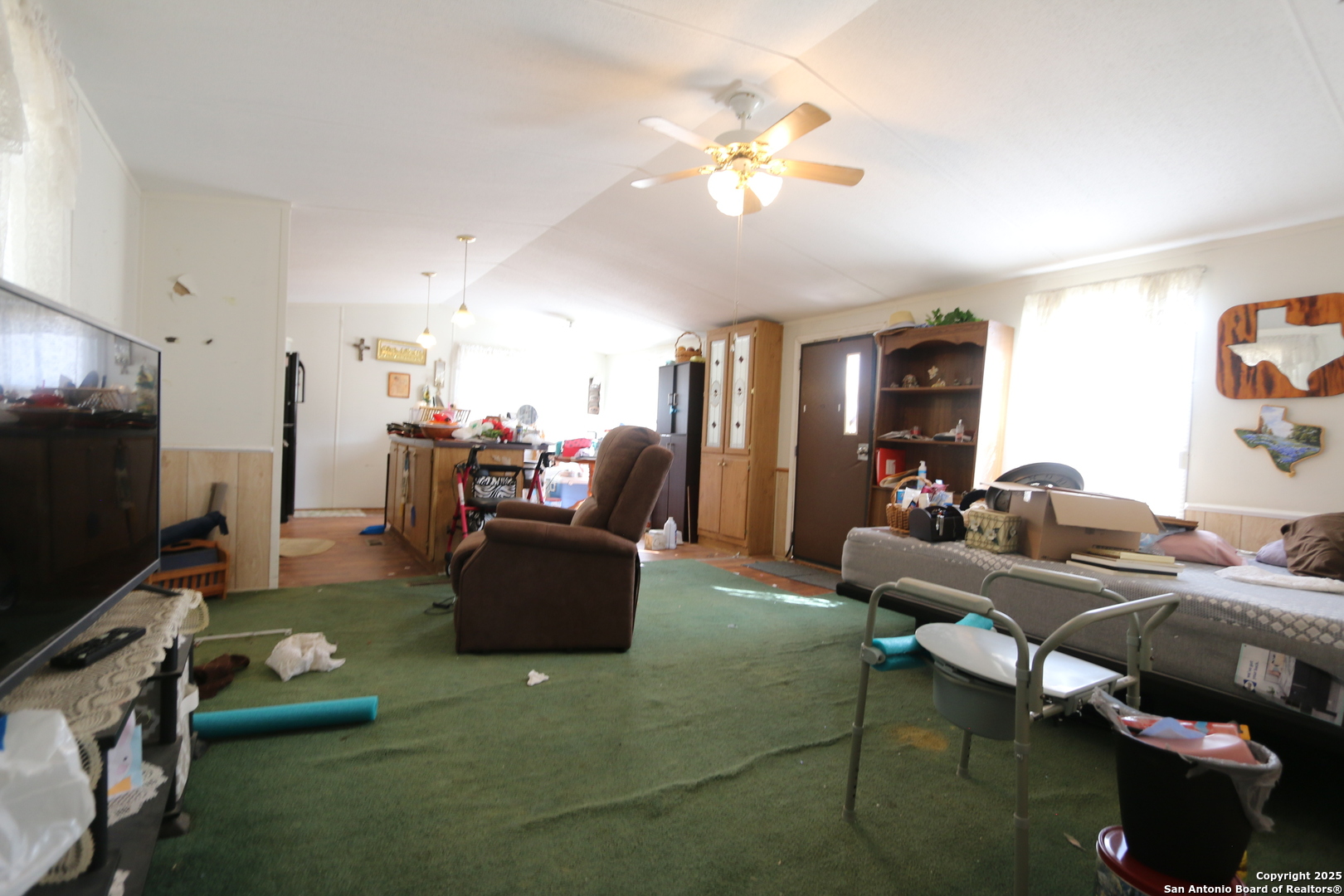13847 Highway 87 Adkins, TX 78101 - Photo 13 of 23 a living room with furniture and a flat screen tv