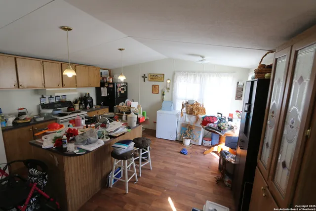 a view of a kitchen and dining room