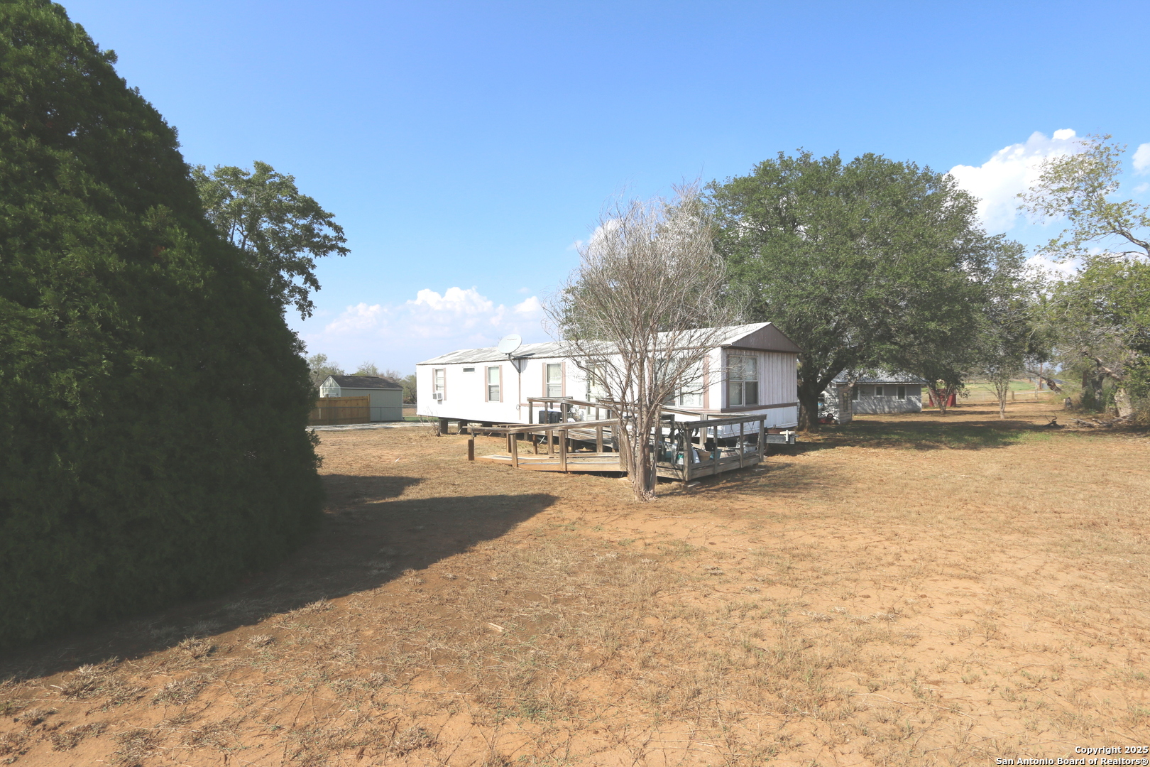 13847 Highway 87 Adkins, TX 78101 - Photo 3 of 23 a view of a lake with houses