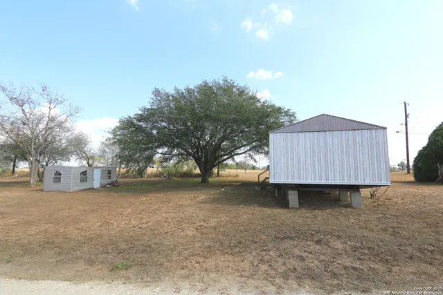 a view of backyard of house