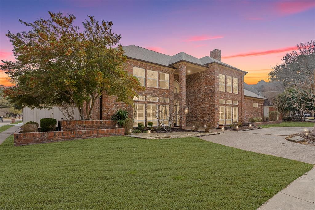 a large building with trees in front of it