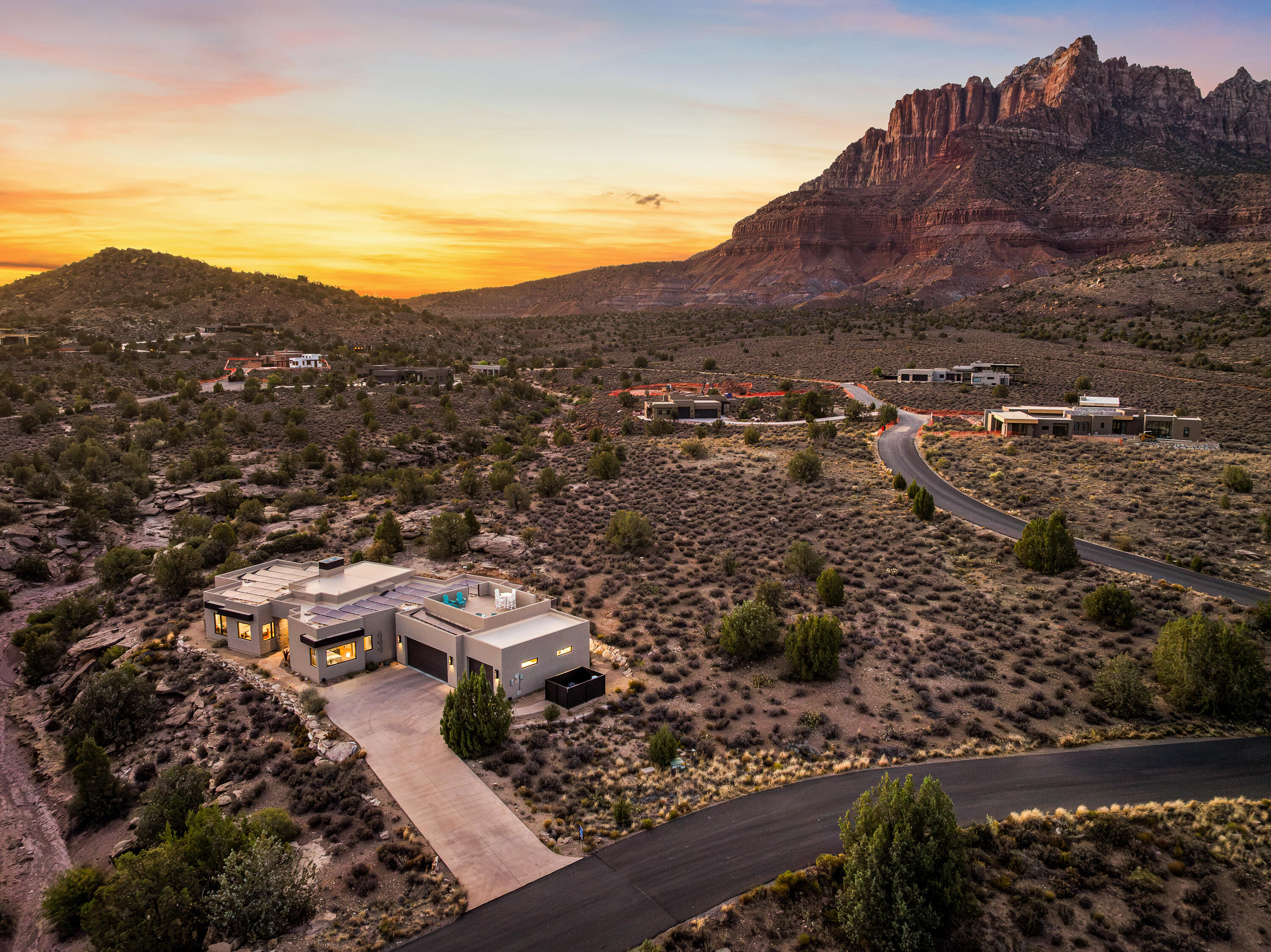 3000 Navajo Way Springdale, UT 84767 - Photo 57 of 63 Sunset aerial showing the home's setting among the red rock formations of the Zion gateway.