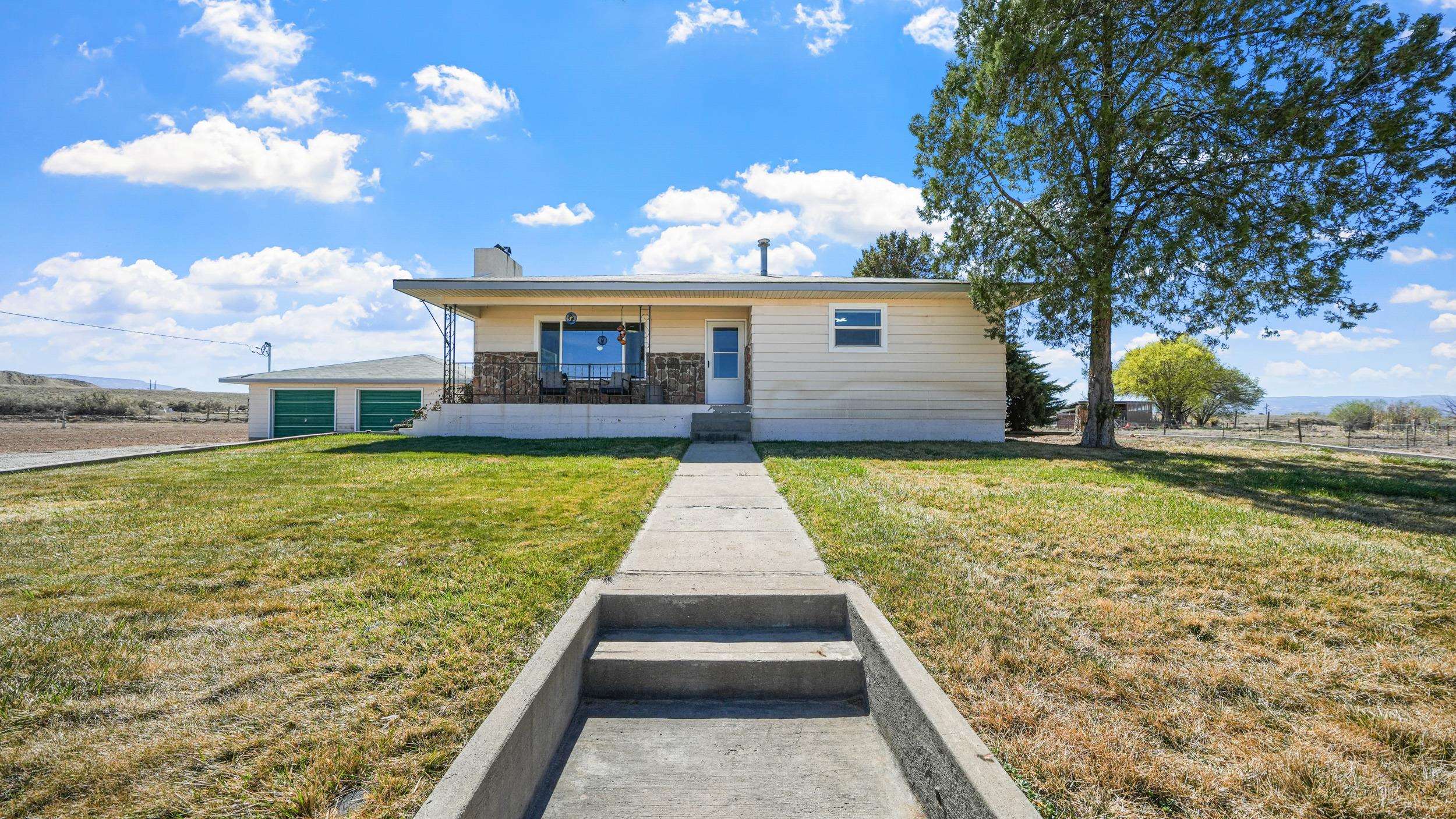 3445 C C 1/2 Road Palisade, CO 81526 - Photo 2 of 37 a view of a house with swimming pool