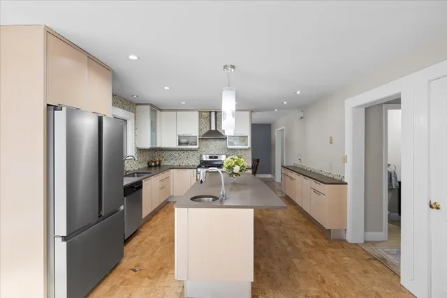 a view of a workspace with furniture and a ceiling fan