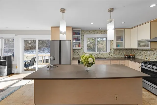 a view of walk in closet with wooden floor and a window
