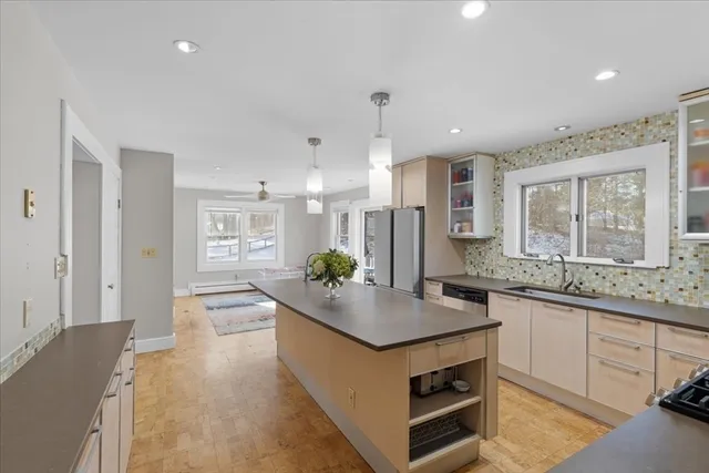 a spacious bedroom with a bed and a window