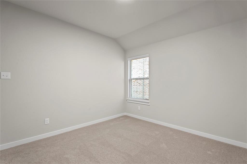 507 Avocet Road Princeton, TX 75407 - Photo 20 of 31 Neutral paint palette with a single window featuring blinds, textured carpeting, and white trim