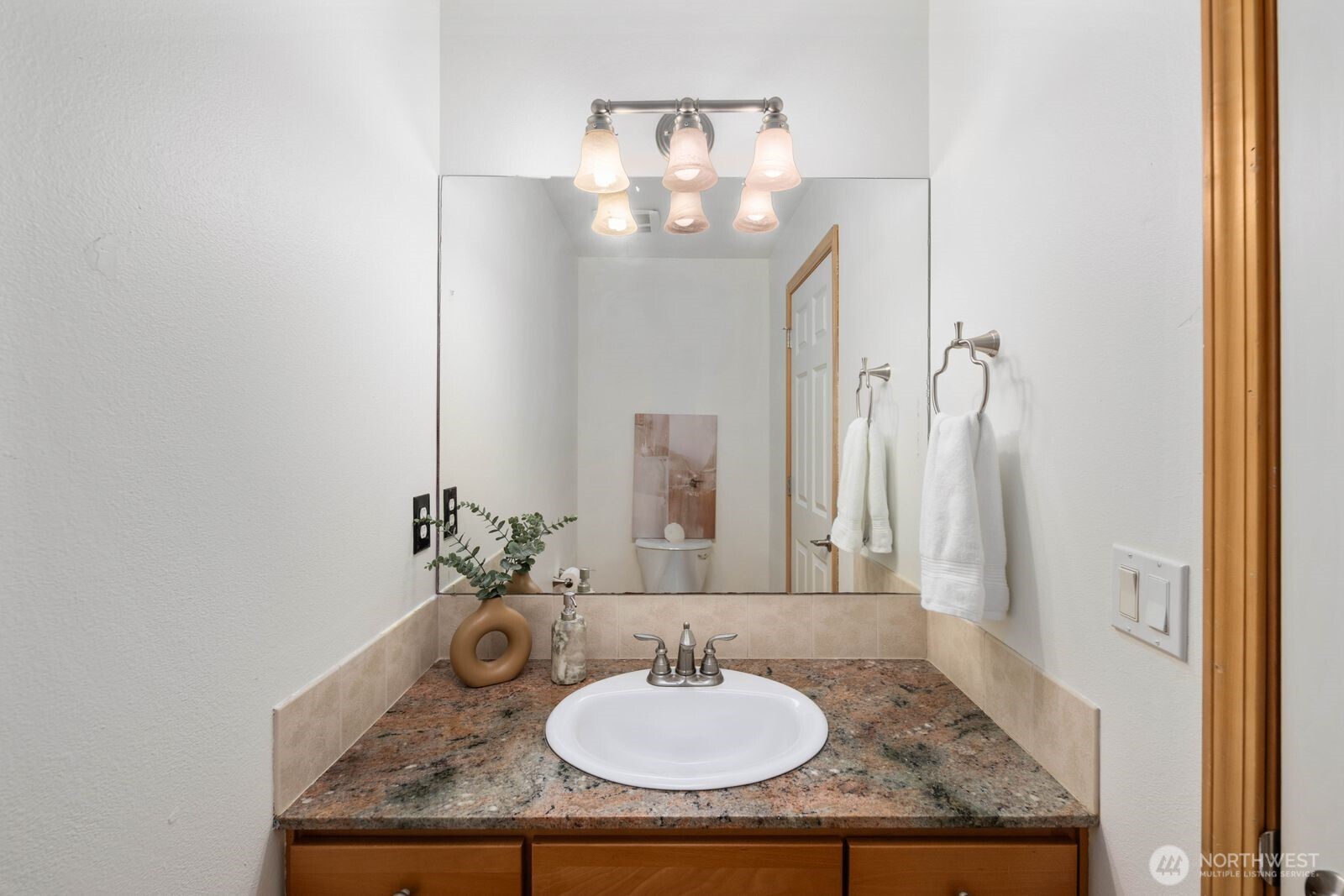 22217 Old Owen Road Monroe, WA 98272 - Photo 22 of 34 a bathroom with a granite countertop sink a mirror and a vanity