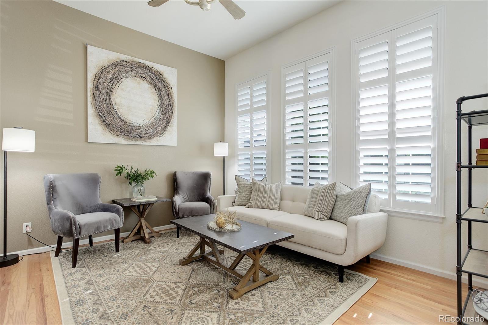 674 Bristle Pine Circle, Unit D Highlands Ranch, CO 80129 - Photo 12 of 31 a living room with furniture and a large window