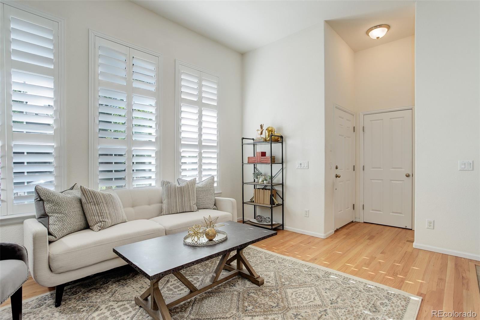 674 Bristle Pine Circle, Unit D Highlands Ranch, CO 80129 - Photo 14 of 31 a living room with furniture and a window