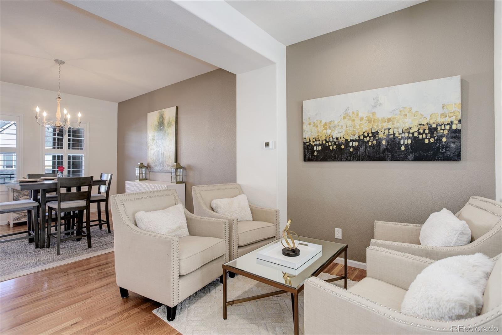 674 Bristle Pine Circle, Unit D Highlands Ranch, CO 80129 - Photo 15 of 31 a living room with furniture and wooden floor