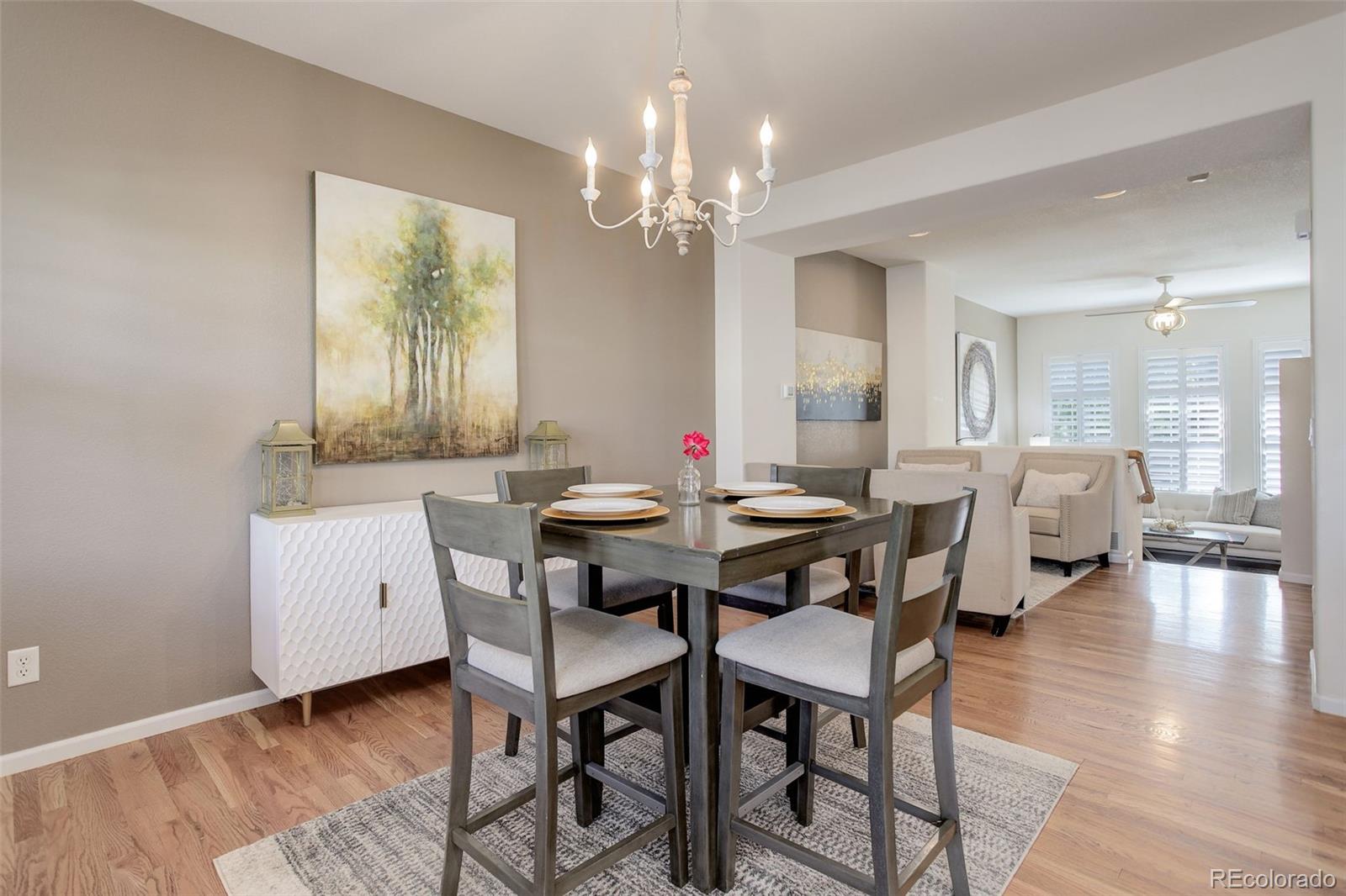 674 Bristle Pine Circle, Unit D Highlands Ranch, CO 80129 - Photo 18 of 31 a view of a dining room with furniture and wooden floor