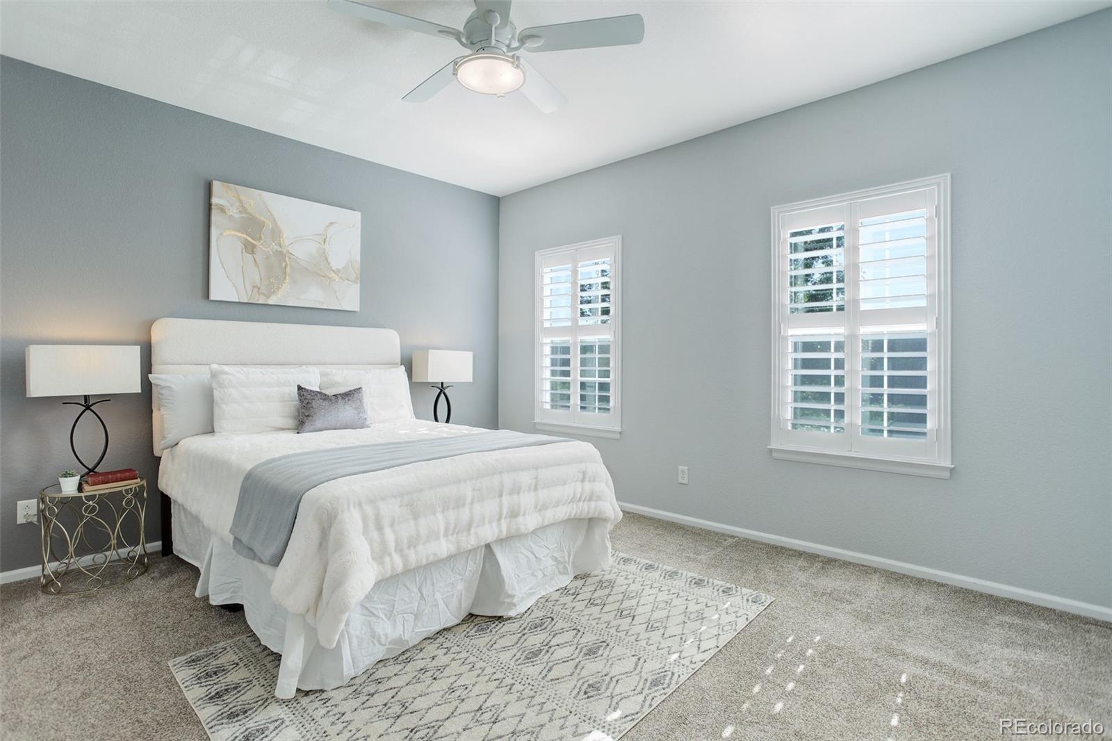 674 Bristle Pine Circle, Unit D Highlands Ranch, CO 80129 - Photo 6 of 31 a bedroom with a large bed and a window