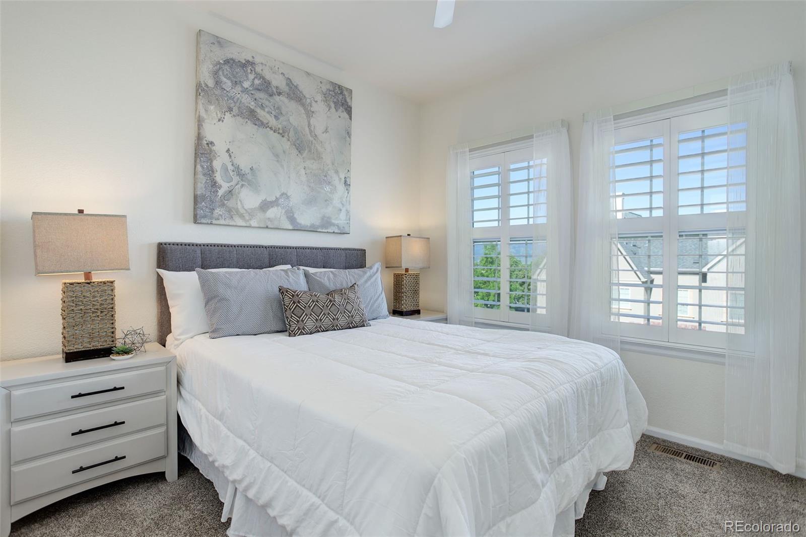 674 Bristle Pine Circle, Unit D Highlands Ranch, CO 80129 - Photo 9 of 31 a bedroom with a bed and a window