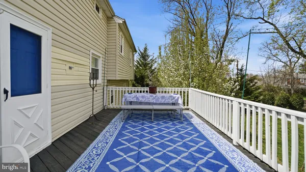 a view of a chairs and tables in the back yard