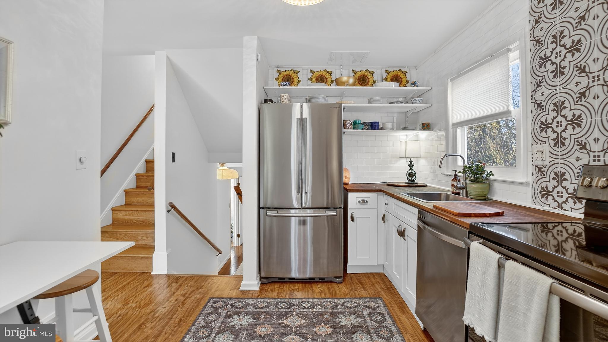 206 Mountain Road Linthicum Heights, MD 21090 - Photo 16 of 53 a kitchen with stainless steel appliances granite countertop a refrigerator and a stove
