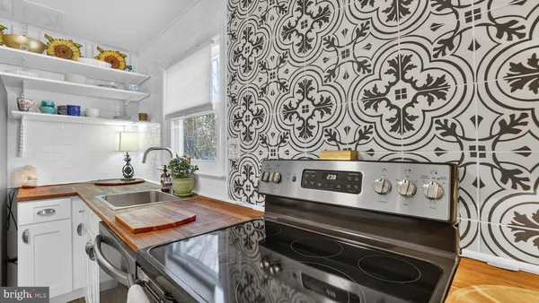 a kitchen with stainless steel appliances granite countertop a stove and a refrigerator