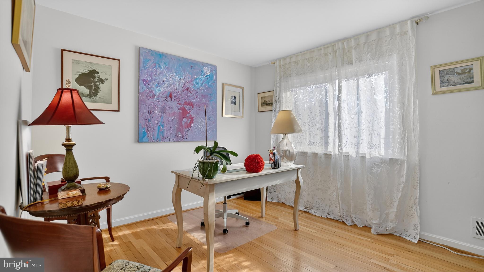 206 Mountain Road Linthicum Heights, MD 21090 - Photo 20 of 53 a view of a workspace with furniture and a window