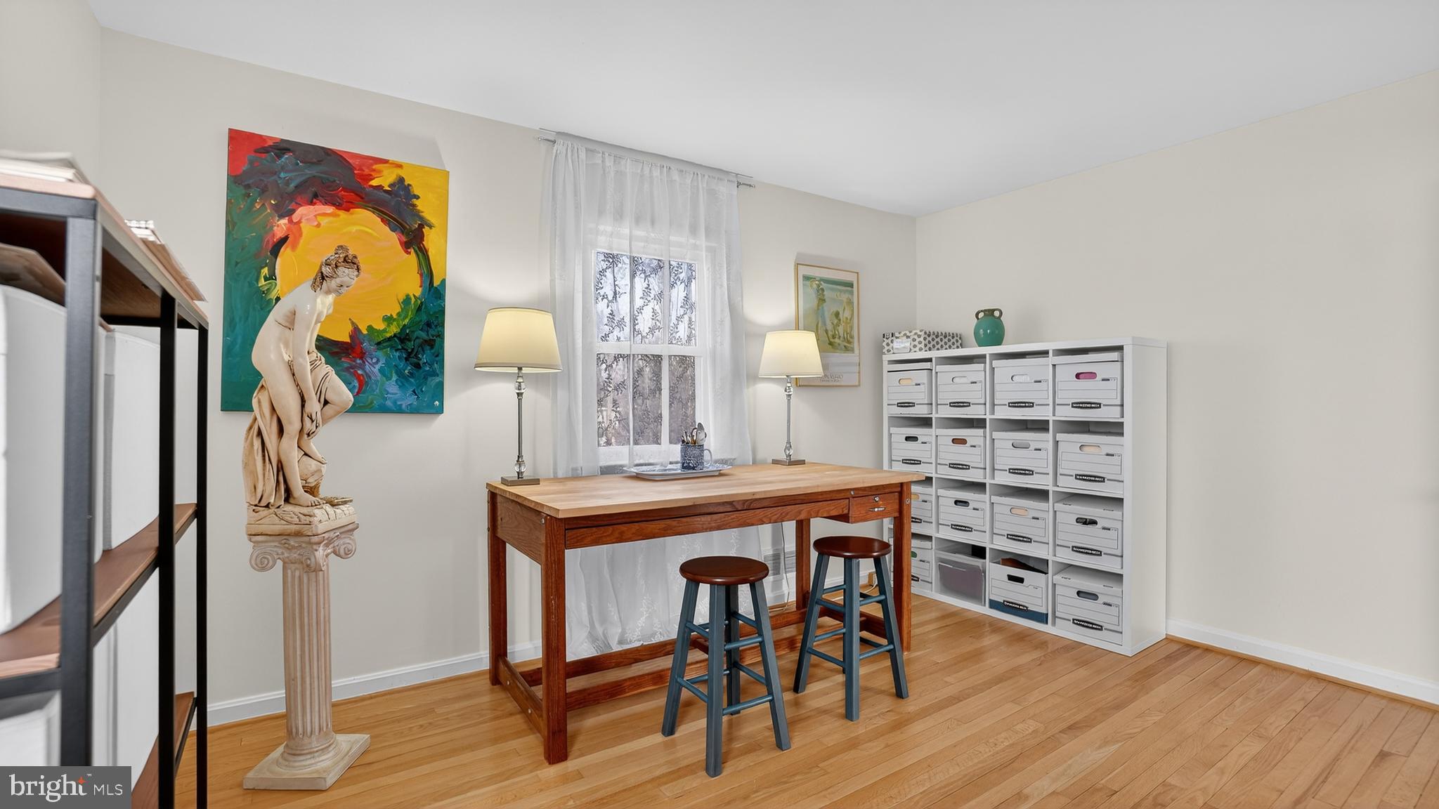 206 Mountain Road Linthicum Heights, MD 21090 - Photo 22 of 53 a view of a workspace with furniture and wooden floor