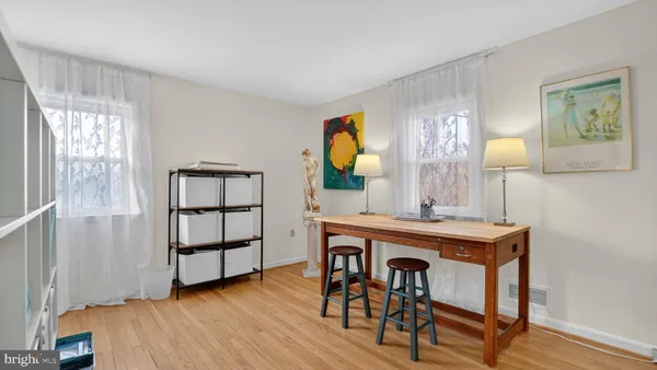 a bedroom with a bed and a chair