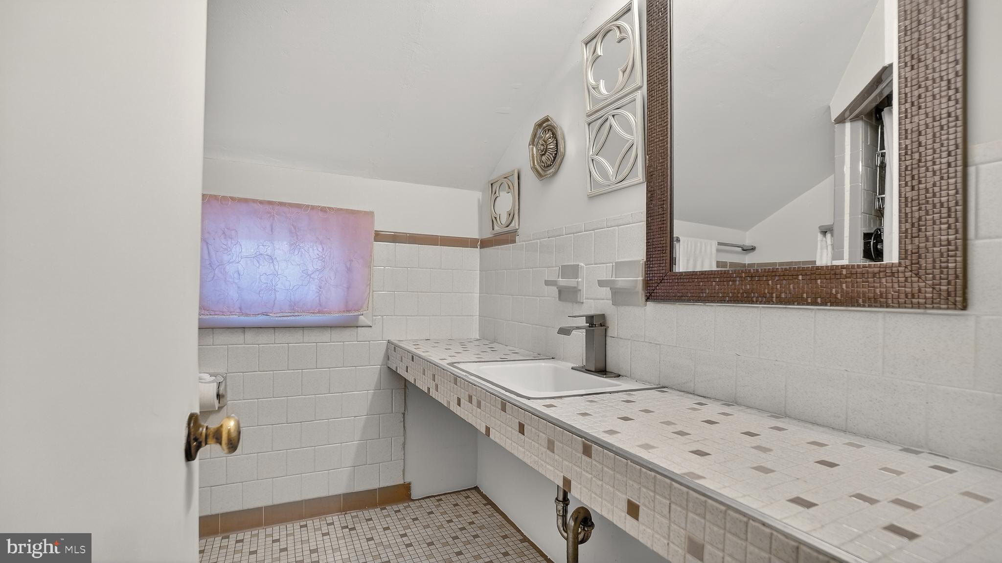 206 Mountain Road Linthicum Heights, MD 21090 - Photo 28 of 53 a bathroom with a sink and a mirror