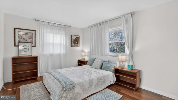 a bedroom with a bed and a couch