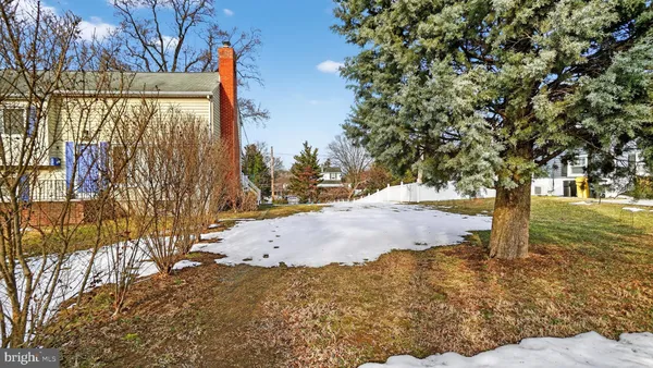 a view of a house with a snow on the road