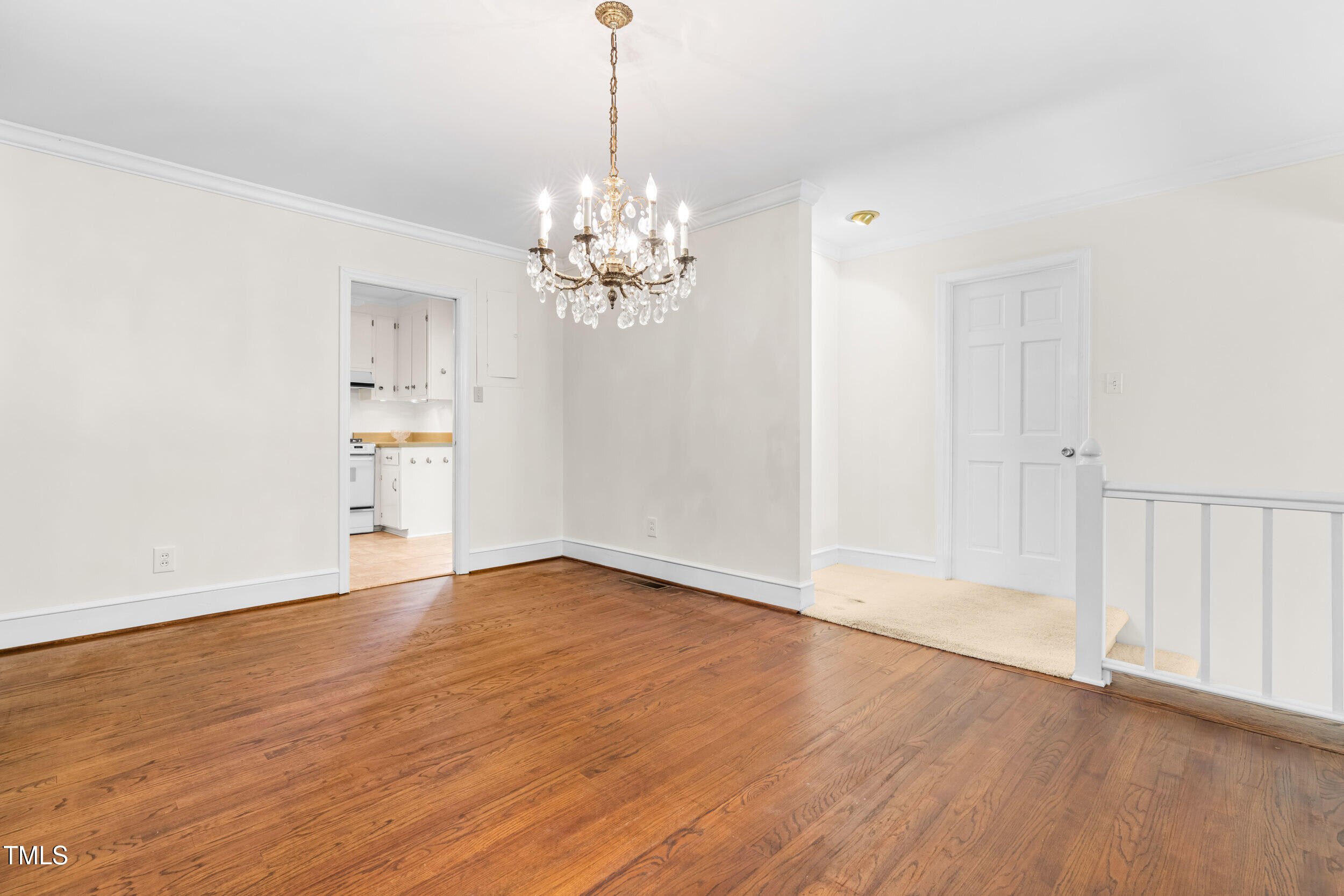 2143 Ridge Road Raleigh, NC 27607 - Photo 17 of 40 a view of an empty room with wooden floor