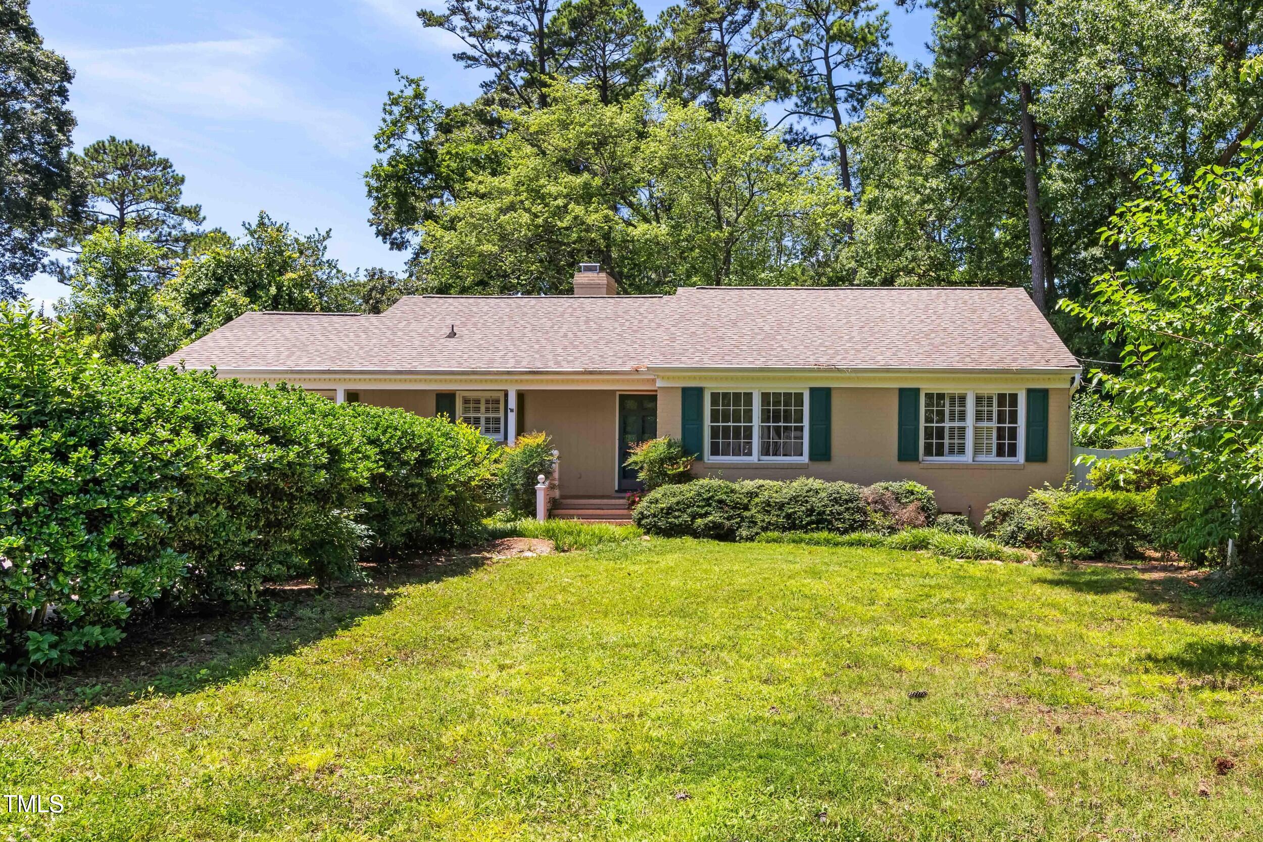 2143 Ridge Road Raleigh, NC 27607 - Photo 3 of 40 a view of house with yard and outdoor seating