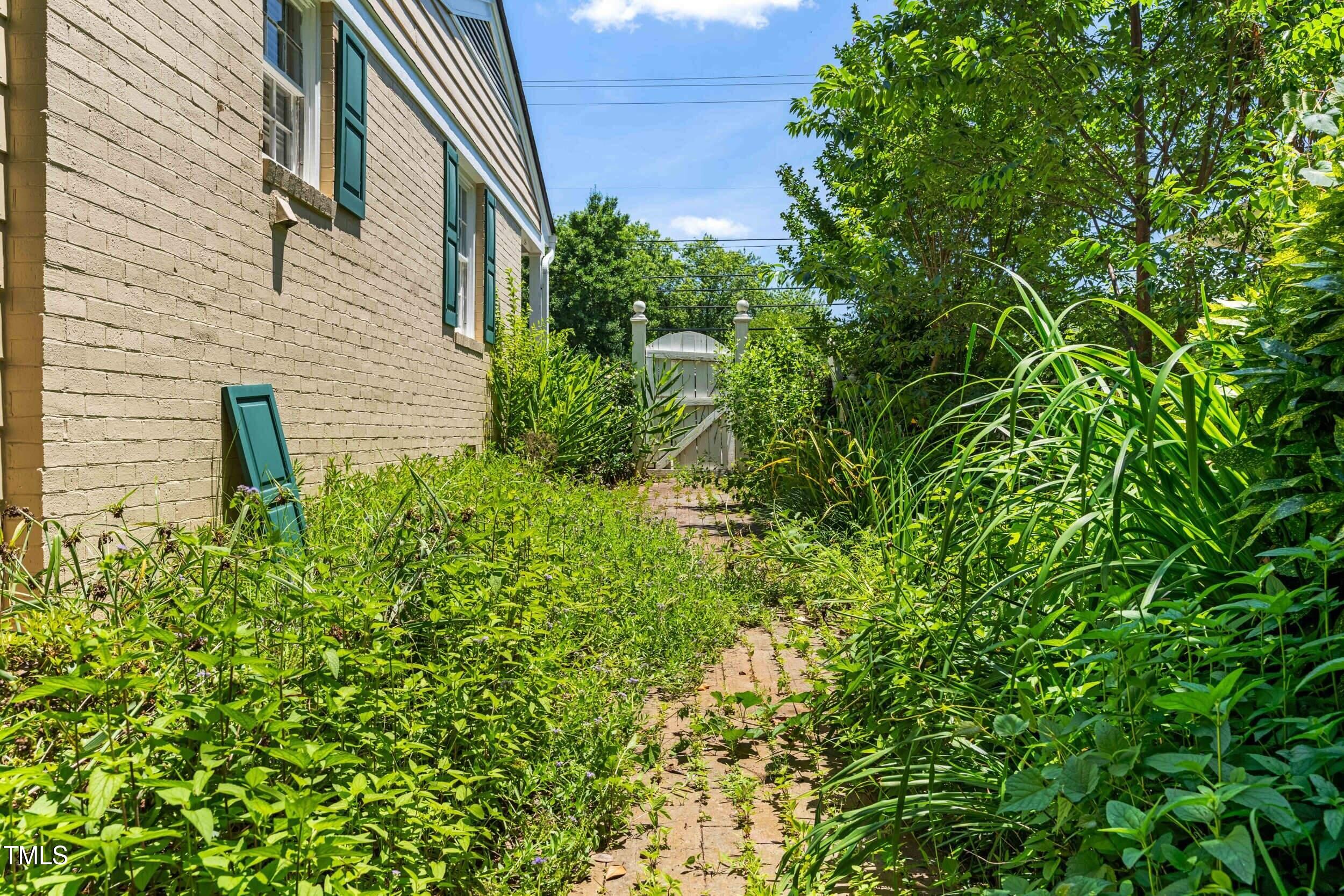 2143 Ridge Road Raleigh, NC 27607 - Photo 34 of 40 a backyard of a house with lots of green space