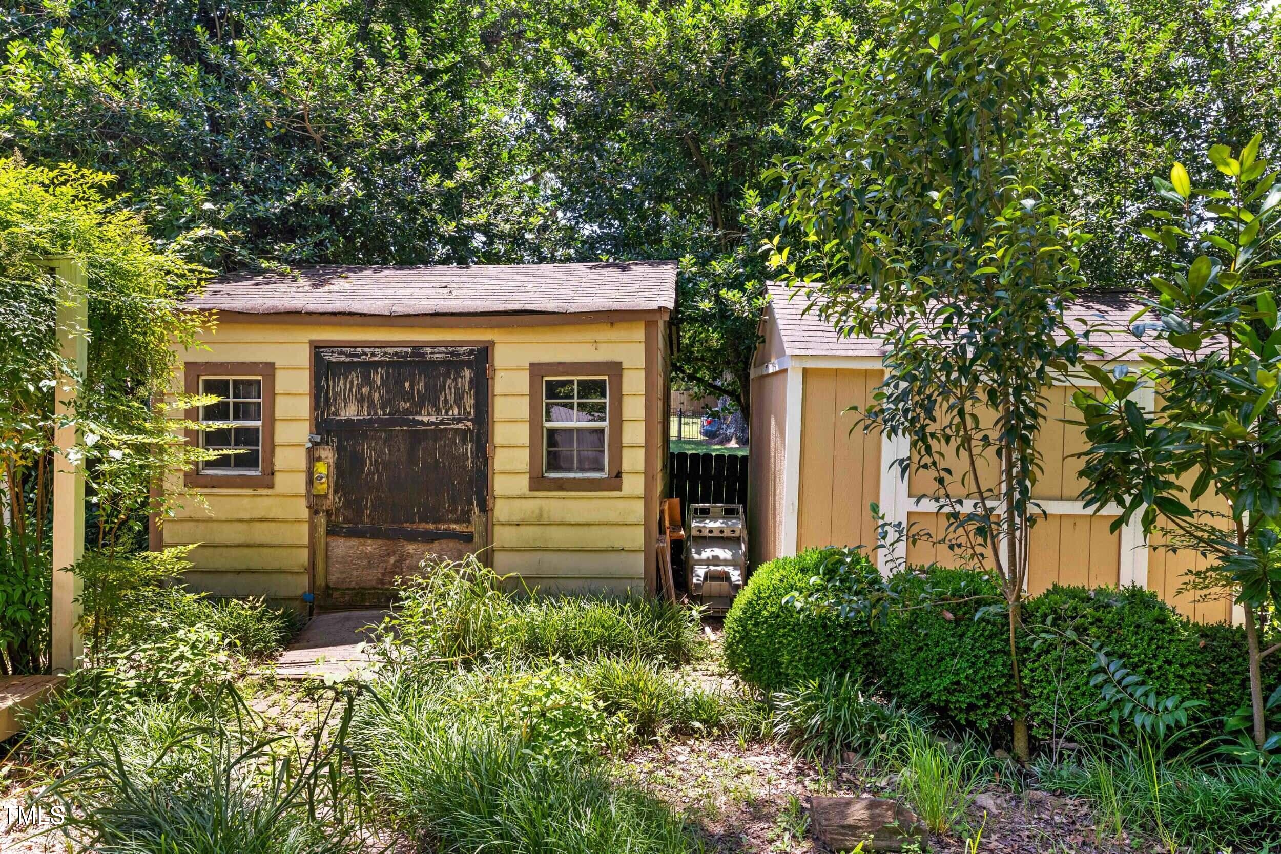 2143 Ridge Road Raleigh, NC 27607 - Photo 36 of 40 front view of a house with a tree in front