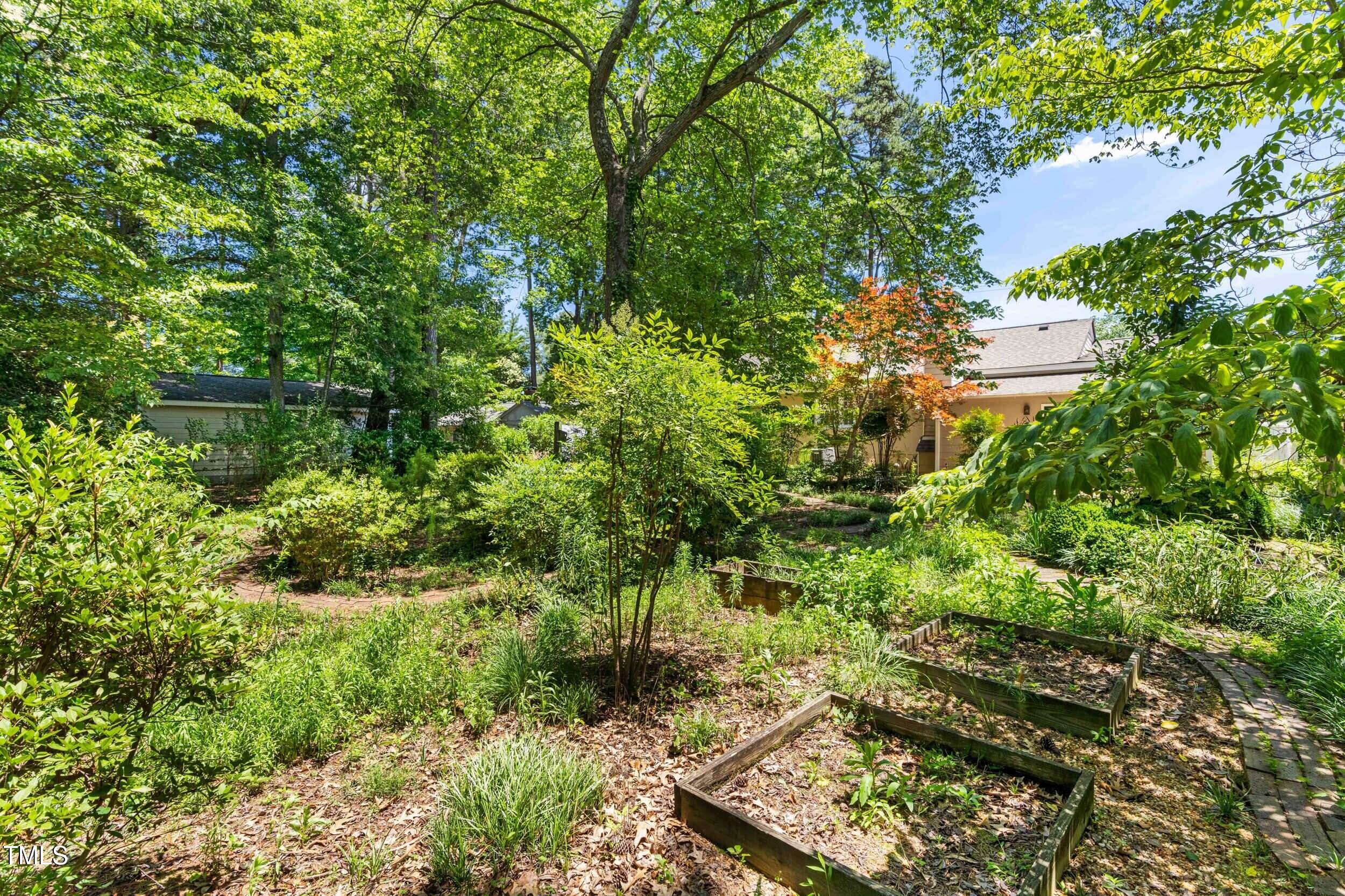 2143 Ridge Road Raleigh, NC 27607 - Photo 37 of 40 a backyard of a house with a yard and outdoor seating