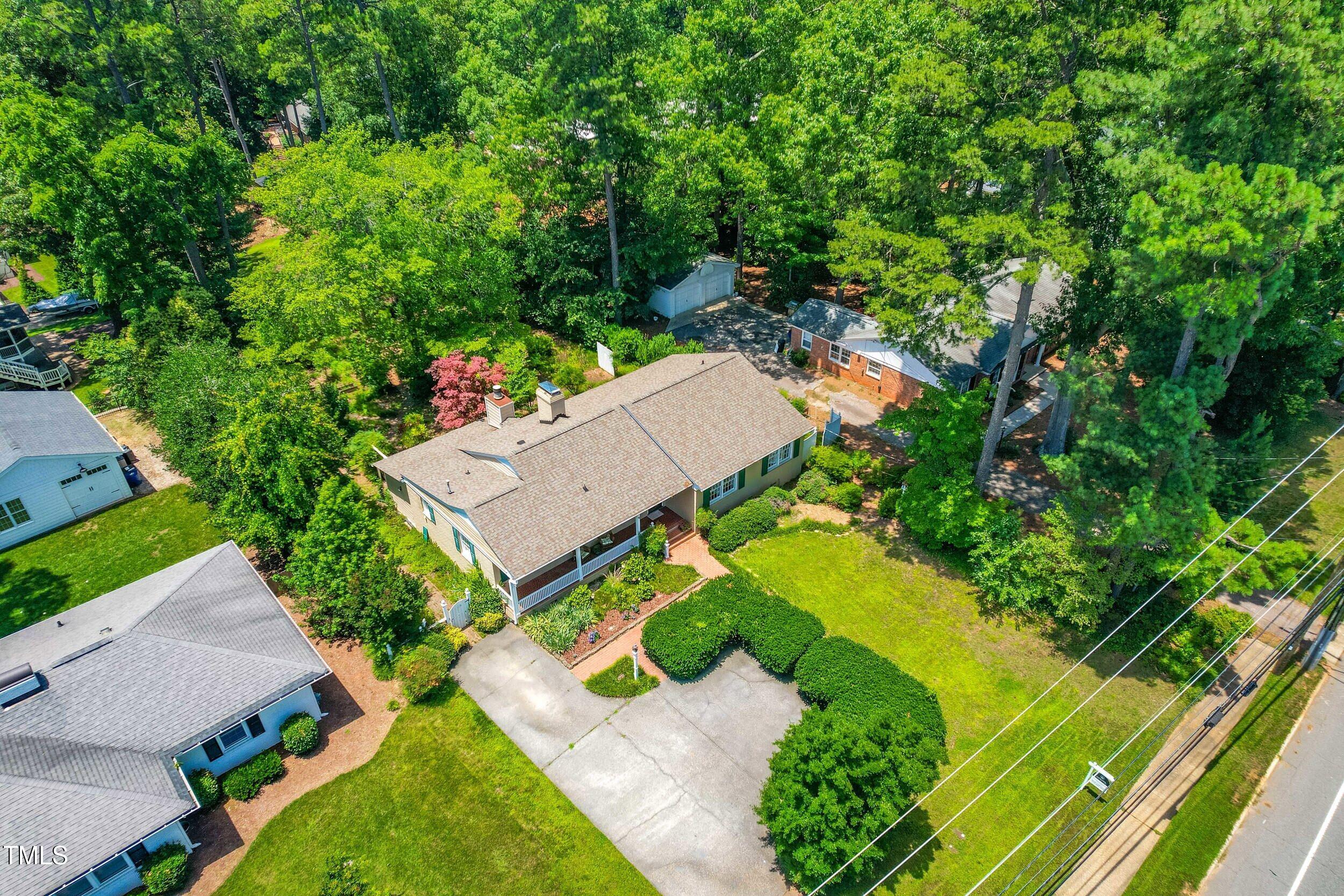 2143 Ridge Road Raleigh, NC 27607 - Photo 6 of 40 an aerial view of a house with a garden