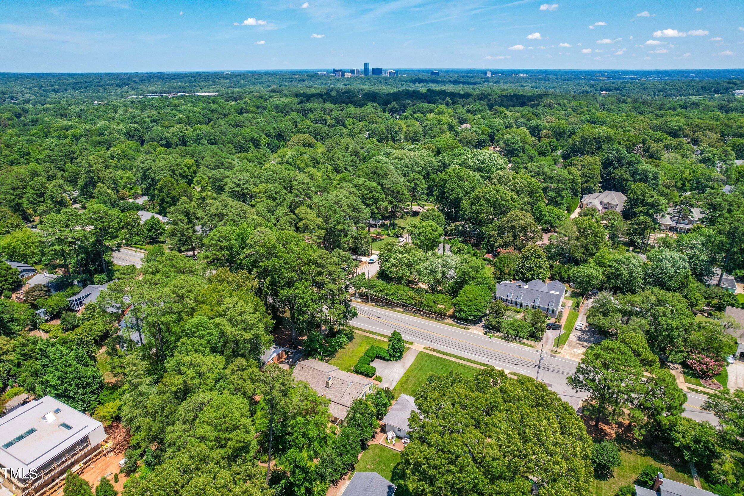 2143 Ridge Road Raleigh, NC 27607 - Photo 7 of 40 an aerial view of a house with a yard and outdoor space