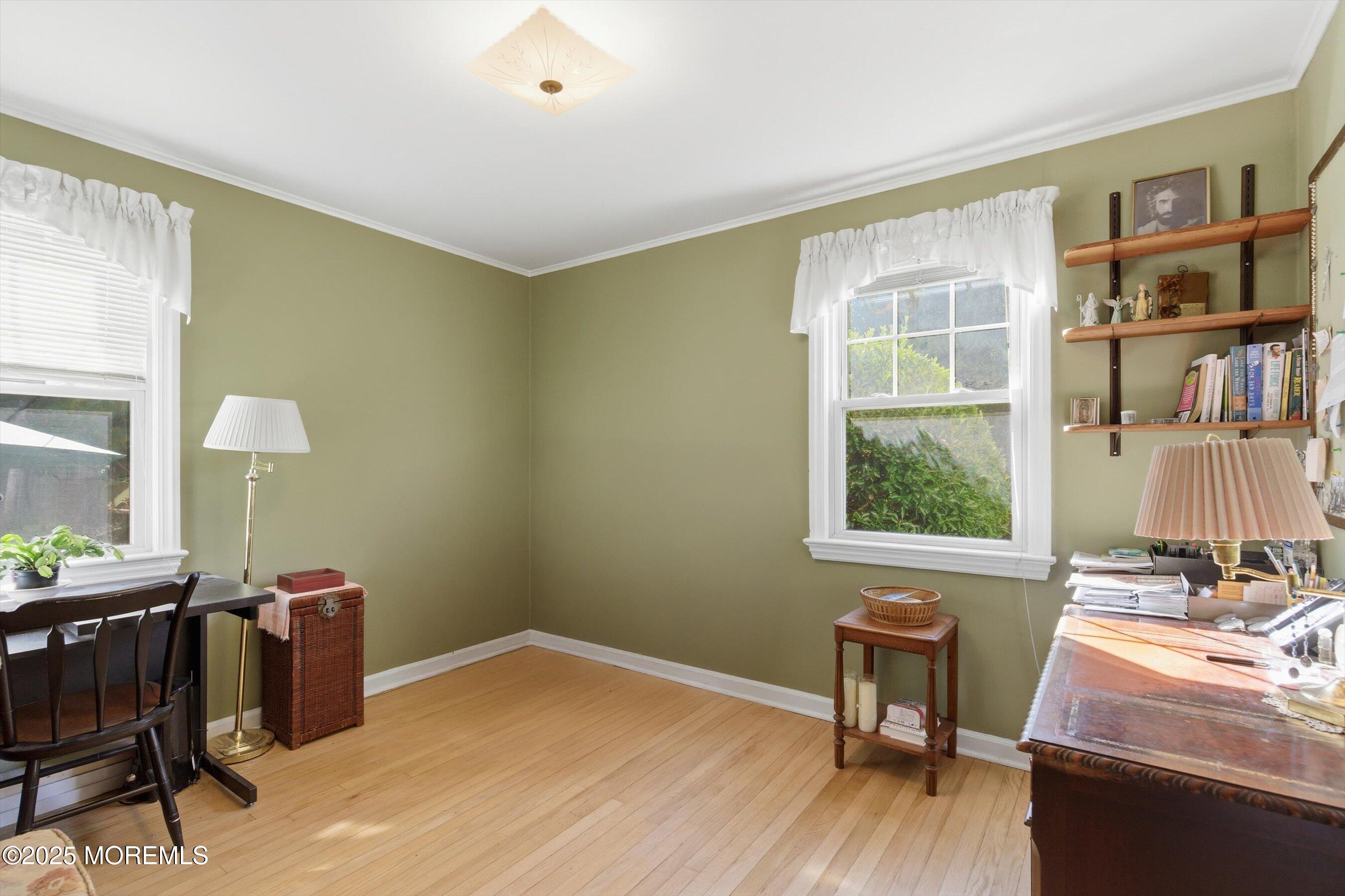 69 Harvard Road Fair Haven, NJ 07704 - Photo 15 of 30 a workspace with furniture bookshelf and a window