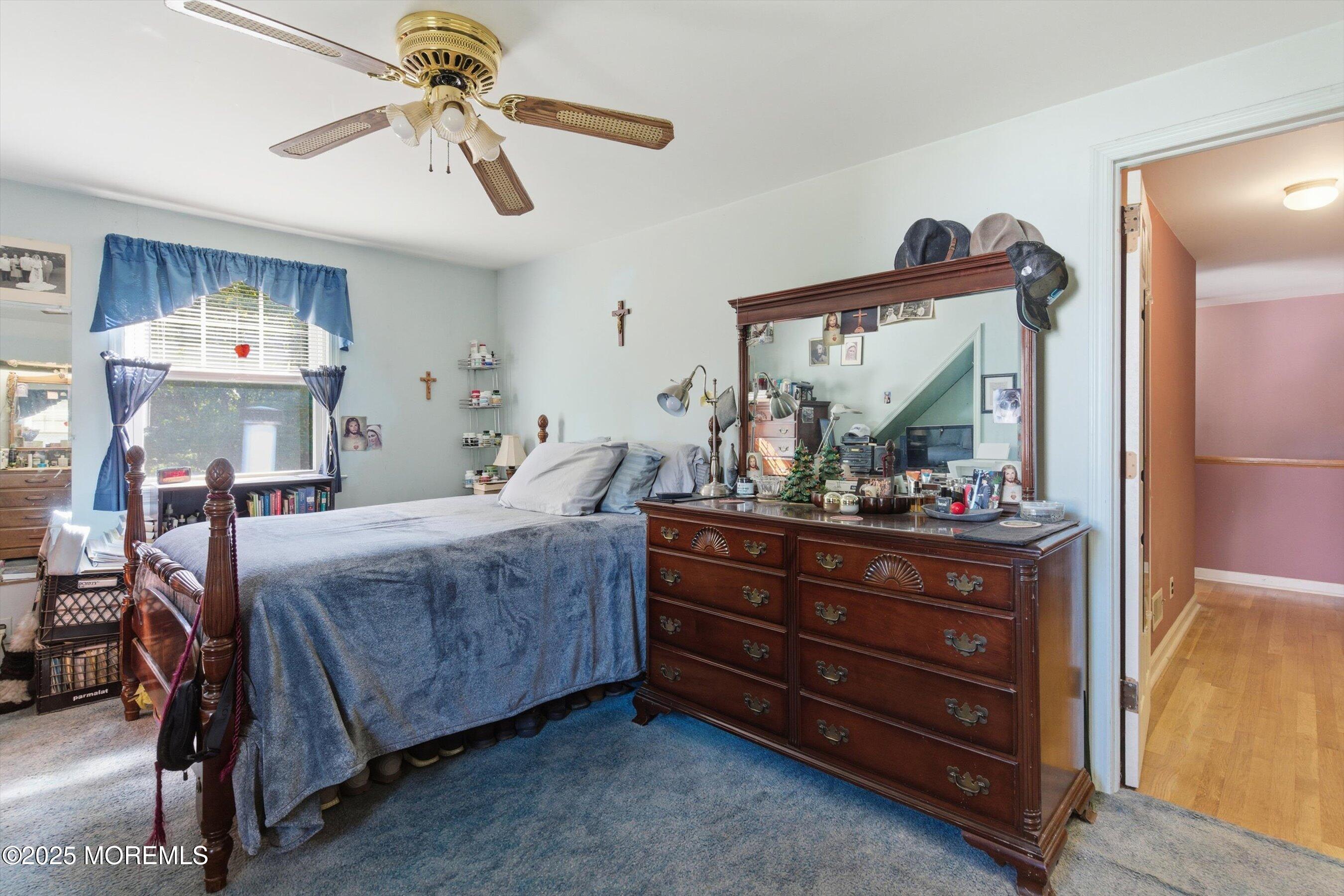 69 Harvard Road Fair Haven, NJ 07704 - Photo 20 of 30 a bed room with a bed and a mirror