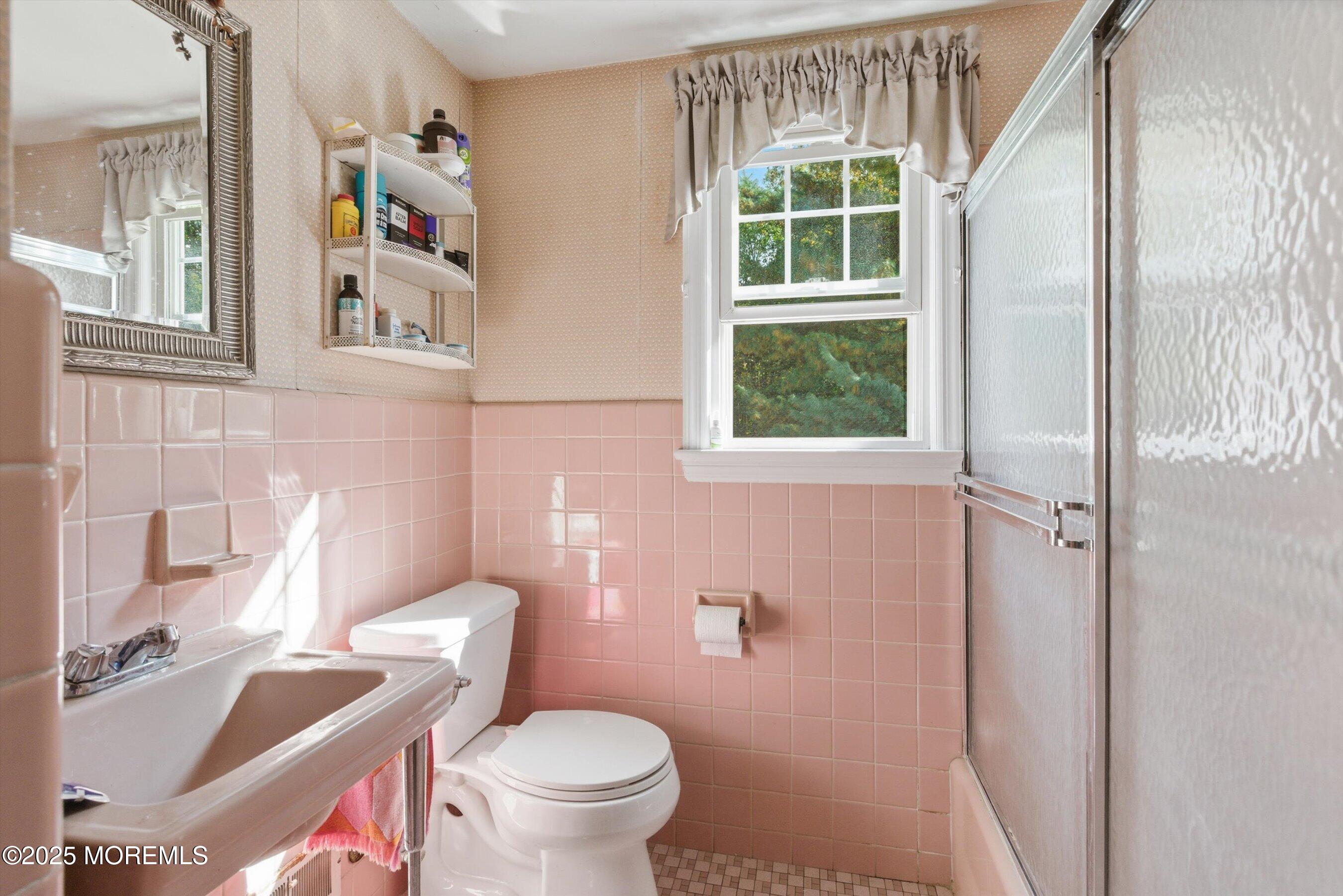 69 Harvard Road Fair Haven, NJ 07704 - Photo 21 of 30 a white toilet sitting next to a bathroom sink