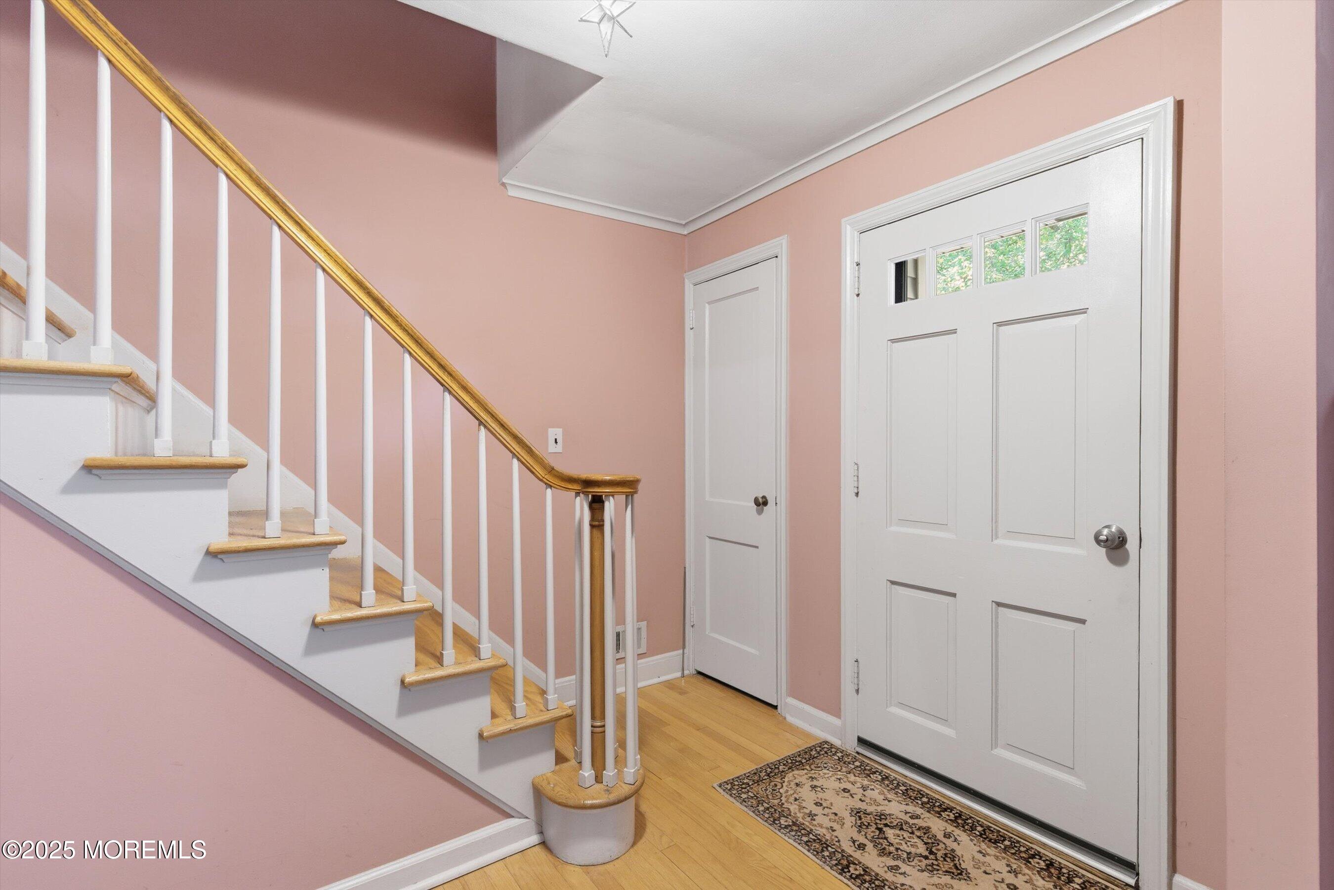 69 Harvard Road Fair Haven, NJ 07704 - Photo 3 of 30 a view of entryway with wooden floor and front door