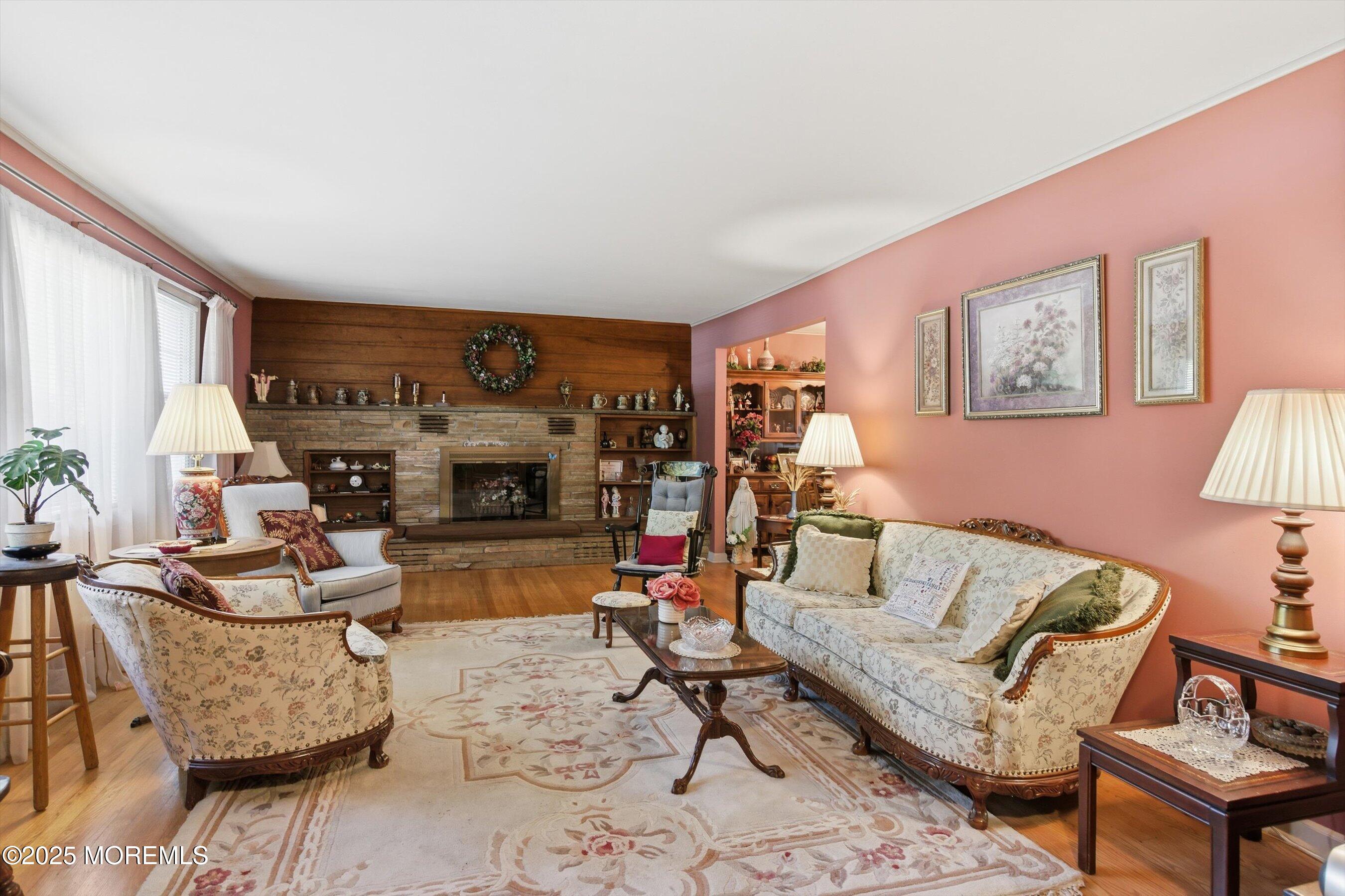 69 Harvard Road Fair Haven, NJ 07704 - Photo 4 of 30 a living room with furniture and a fireplace