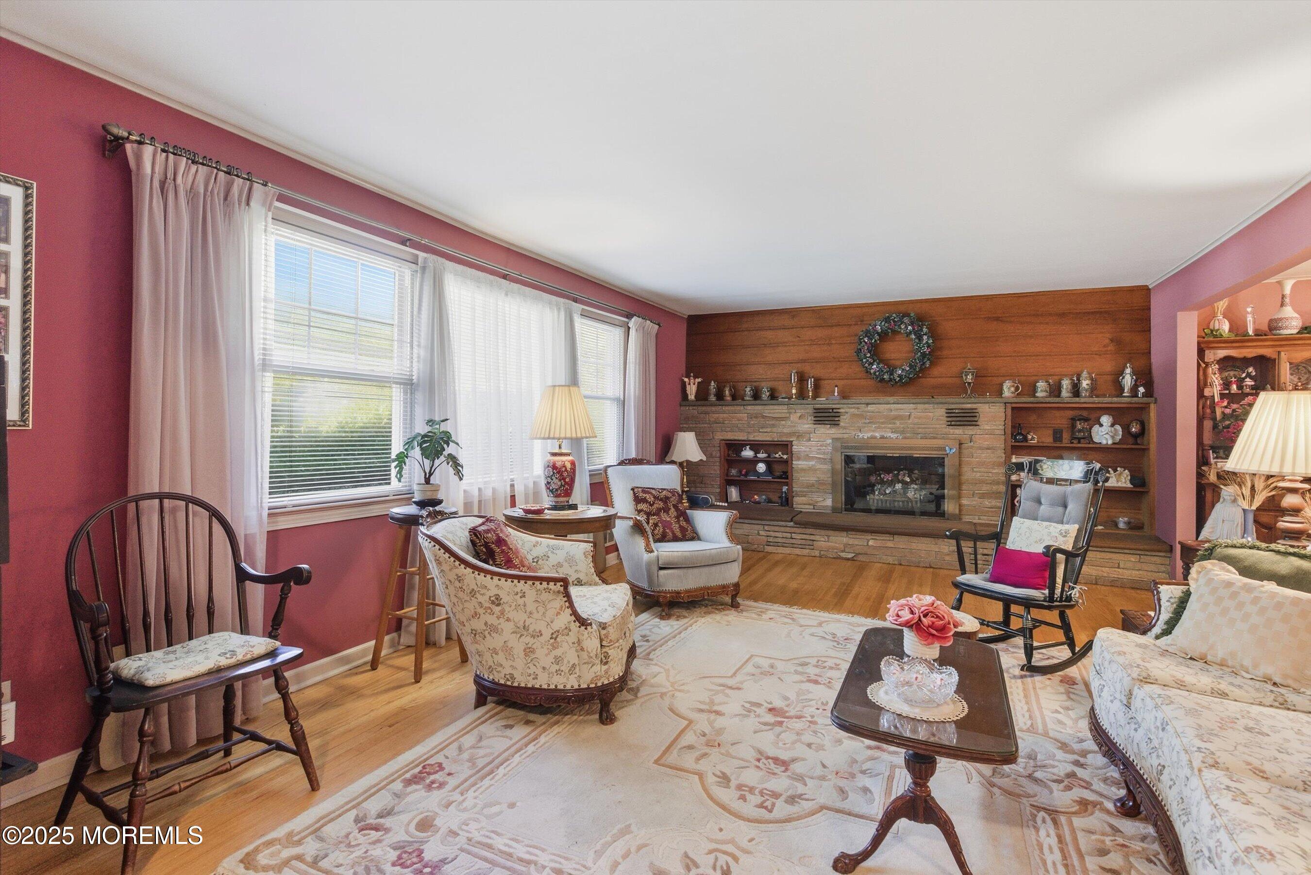 69 Harvard Road Fair Haven, NJ 07704 - Photo 5 of 30 a living room with furniture and a fireplace