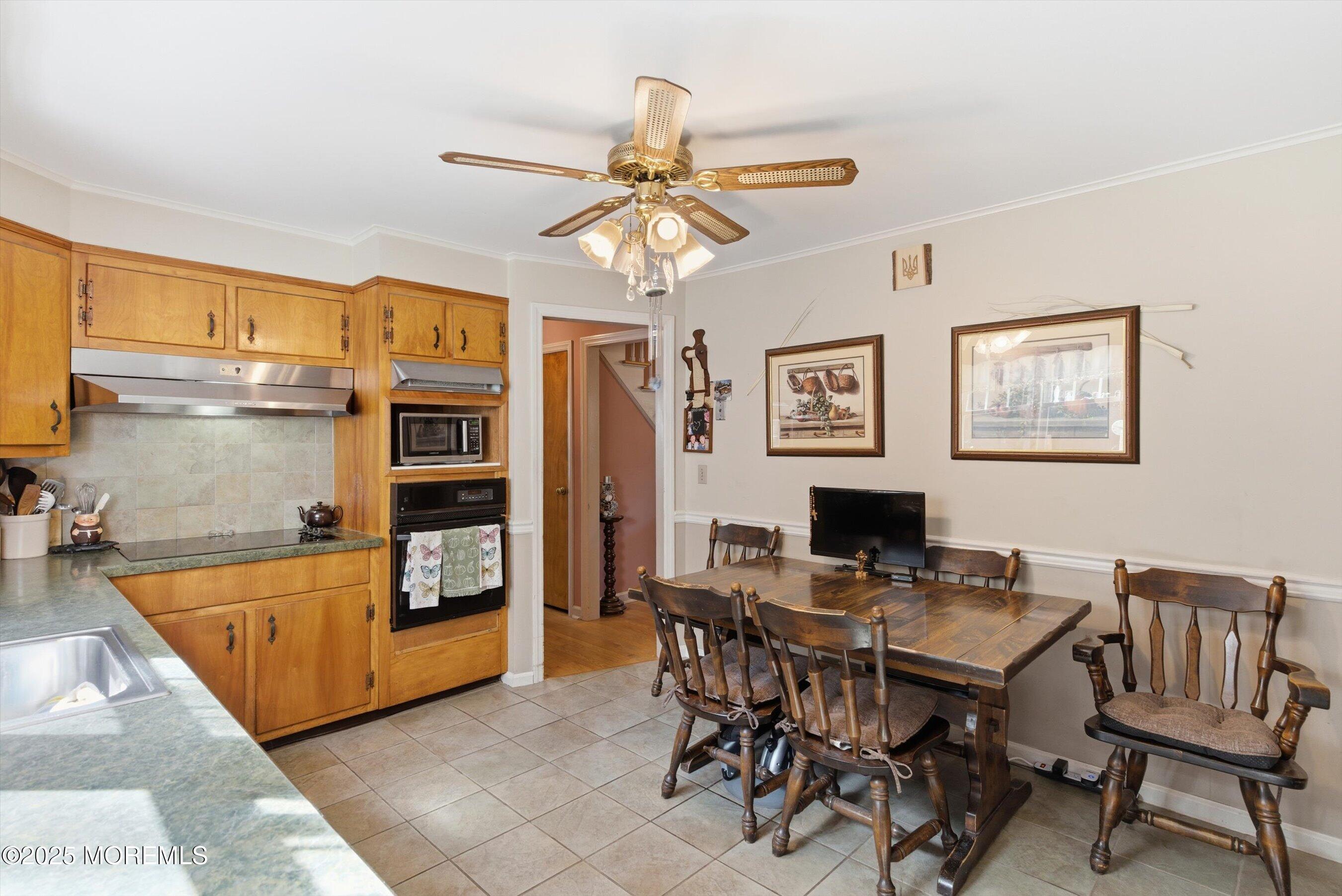 69 Harvard Road Fair Haven, NJ 07704 - Photo 9 of 30 a view of a dining room with furniture window and wooden floor