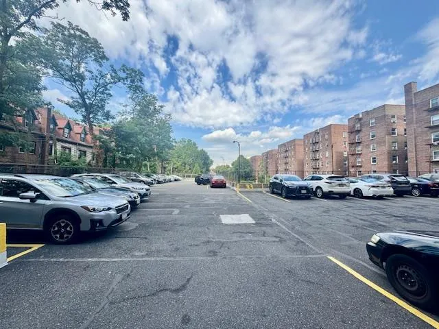 a view of street with parked cars