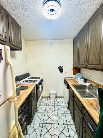 a kitchen with a stove and a sink